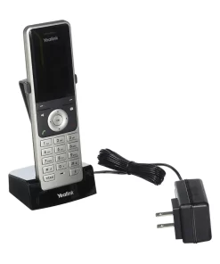 Warehouse worker using Yealink W56H DECT handset - 300m range cordless phone system in UAE business environment